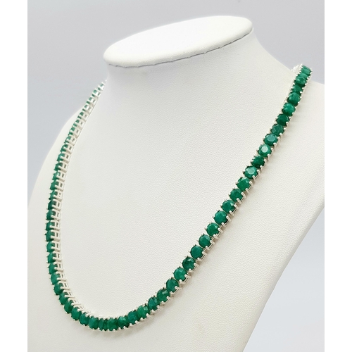 520 - An Emerald Gemstone Tennis Necklace. Set in 925 Silver. 44cm. CD-1669