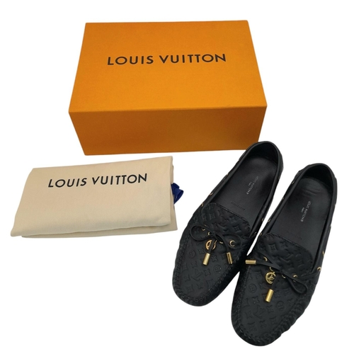 559 - A pair of Louis Vuitton Empreinte Gloria Loafers. Made from black leather with embossed LV monogram,... 