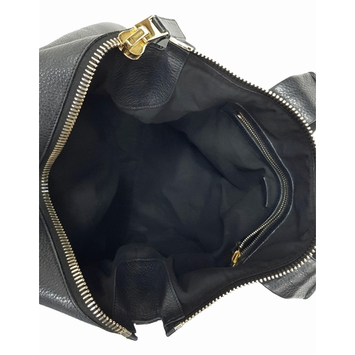 573 - A Tom Ford Black Amber Tote Bag. Pebbled leather exterior with gold-toned hardware, zipper details, ... 