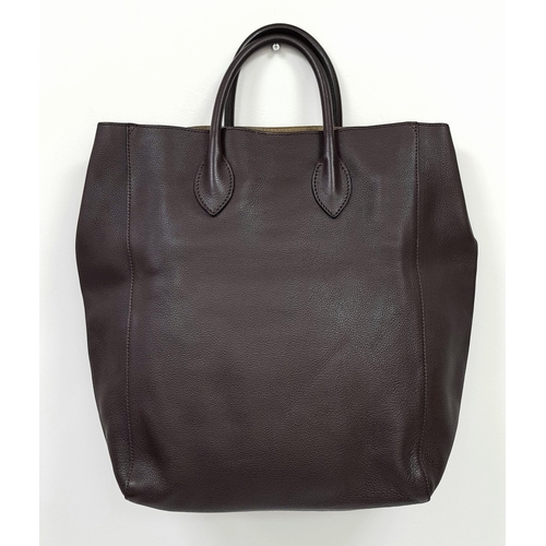 601 - A Burberry Carryall Tote Bag. Dark burgundy leather exterior with gold-toned hardware, four protecti... 