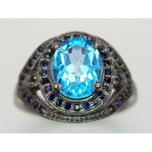 624 - A 2.5ct Blue Topaz Gemstone Ring with Diamond Accents. Set in 925 silver. Size O 1/2. CD-1684