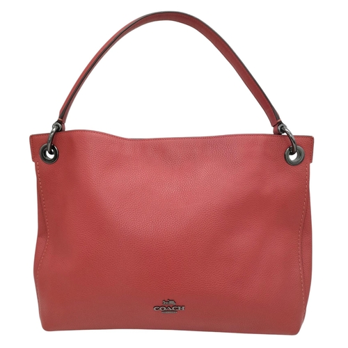 636 - A Coach Coral Clarkson Hobo Bag. Pebbled leather exterior with chrome-toned hardware, zipped compart... 