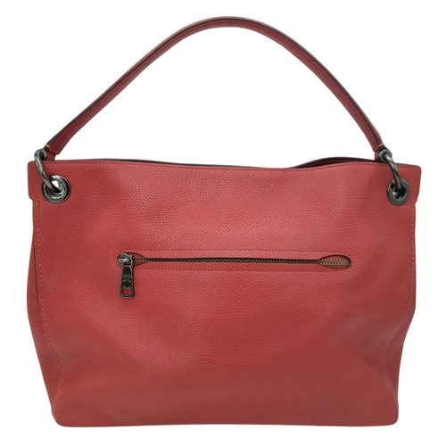 636 - A Coach Coral Clarkson Hobo Bag. Pebbled leather exterior with chrome-toned hardware, zipped compart... 