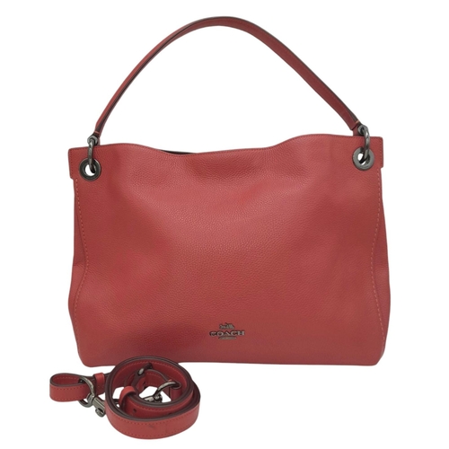 636 - A Coach Coral Clarkson Hobo Bag. Pebbled leather exterior with chrome-toned hardware, zipped compart... 