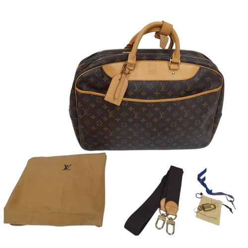 69 - A Louis Vuitton Monogram Alize 24H Boston Bag. LV monogram coated canvas exterior, with natural vach... 