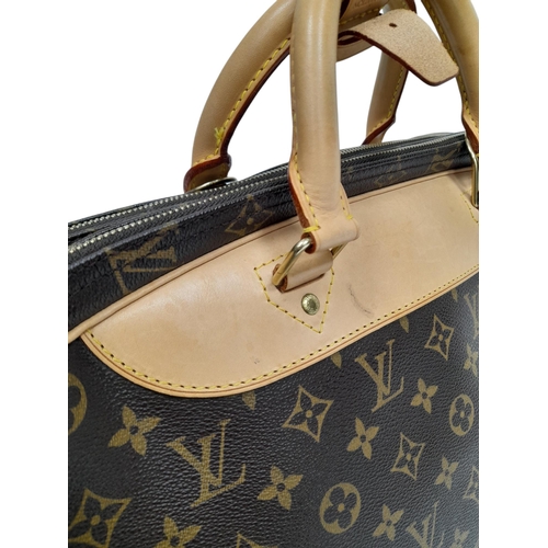 69 - A Louis Vuitton Monogram Alize 24H Boston Bag. LV monogram coated canvas exterior, with natural vach... 