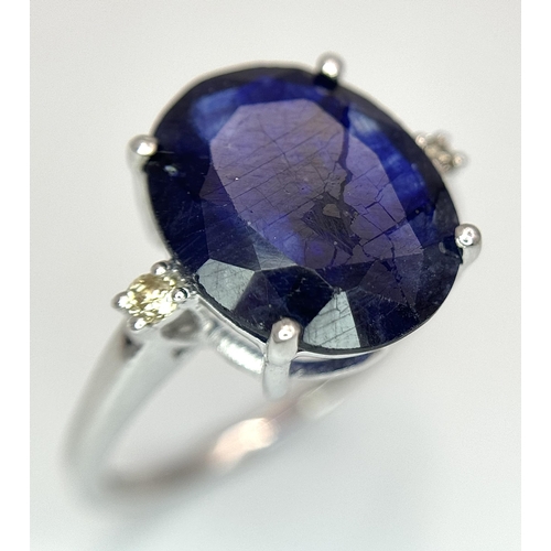 701 - An 8ct Blue Sapphire Ring with Diamond Accents. Set in 925 Silver. Size M 1/2. CD-1687