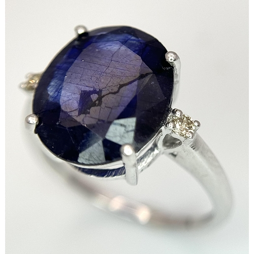 701 - An 8ct Blue Sapphire Ring with Diamond Accents. Set in 925 Silver. Size M 1/2. CD-1687