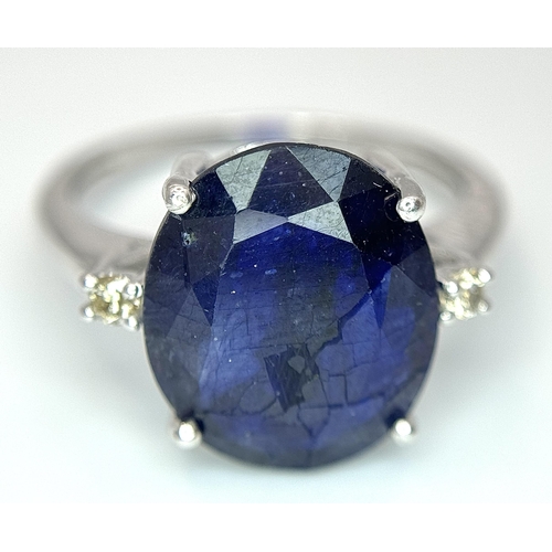 701 - An 8ct Blue Sapphire Ring with Diamond Accents. Set in 925 Silver. Size M 1/2. CD-1687