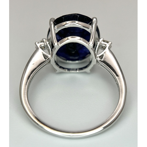 701 - An 8ct Blue Sapphire Ring with Diamond Accents. Set in 925 Silver. Size M 1/2. CD-1687