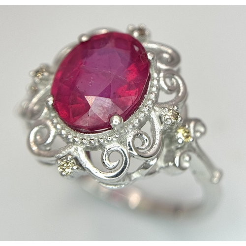 708 - A 4ct Oval Cut Ruby Ring with Diamond Accents. Set in 925 Silver. Size P 1/2. CD-1686