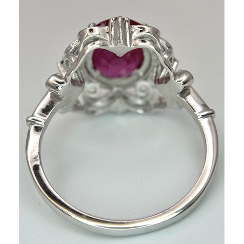 708 - A 4ct Oval Cut Ruby Ring with Diamond Accents. Set in 925 Silver. Size P 1/2. CD-1686