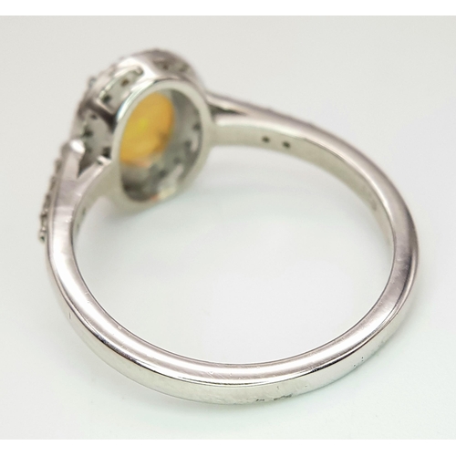 715 - A 1.5ct Fire Opal Ring with 0.30ct of Diamond Accents. Set in 925 Silver. Size N. CD-1682.