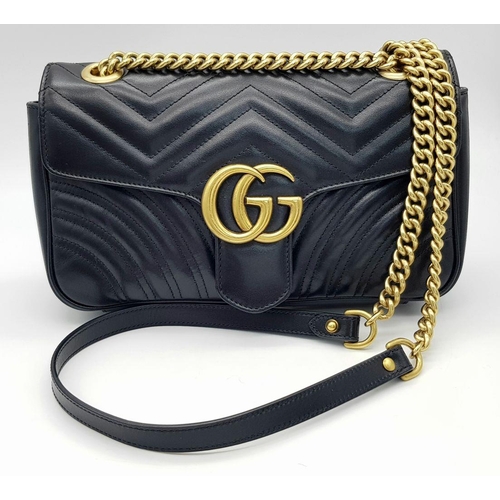 720 - A Gucci Black Marmont Matelassé Bag. Black quilted leather exterior with gold-toned hardware, chain ... 