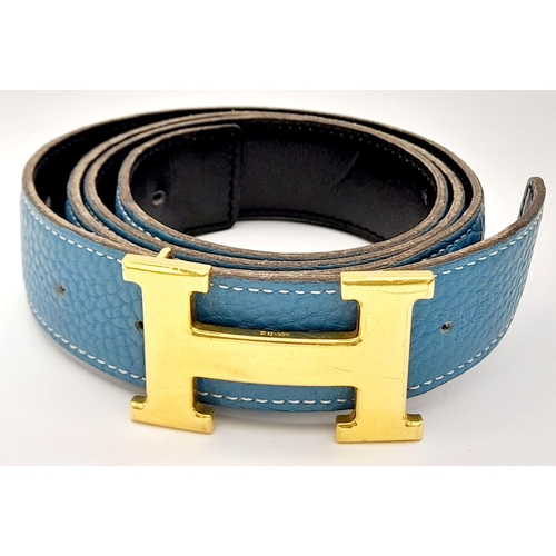 1089 - A Hermes Blue Constance Reversible Belt. Blue grained leather on one side and black smooth leather o... 