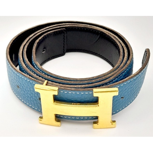 1089 - A Hermes Blue Constance Reversible Belt. Blue grained leather on one side and black smooth leather o... 