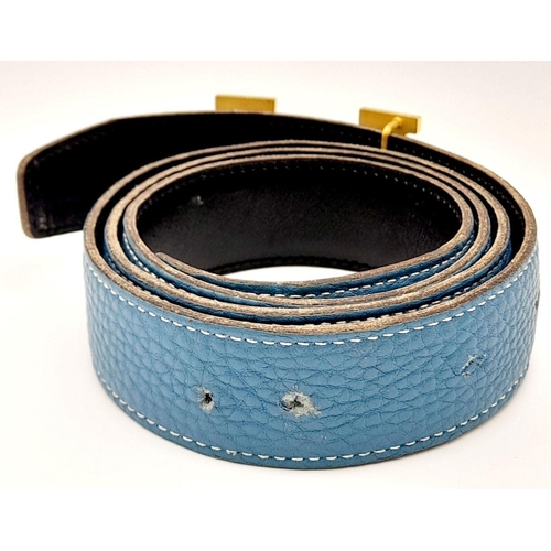 1089 - A Hermes Blue Constance Reversible Belt. Blue grained leather on one side and black smooth leather o... 