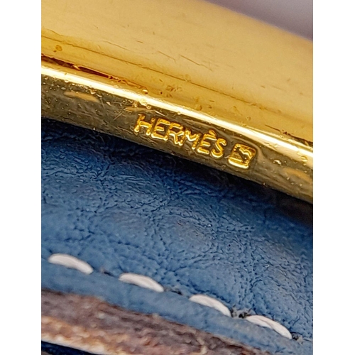 1089 - A Hermes Blue Constance Reversible Belt. Blue grained leather on one side and black smooth leather o... 