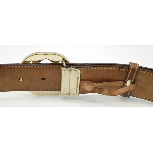 1377 - A Gucci Beige GG Canvas Belt with Gold-Toned GG Buckle. Light gold hardware, 102cm total length. Som... 