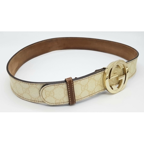 1377 - A Gucci Beige GG Canvas Belt with Gold-Toned GG Buckle. Light gold hardware, 102cm total length. Som... 