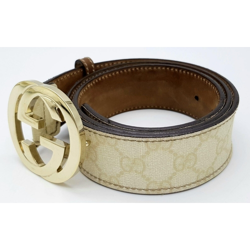 1377 - A Gucci Beige GG Canvas Belt with Gold-Toned GG Buckle. Light gold hardware, 102cm total length. Som... 