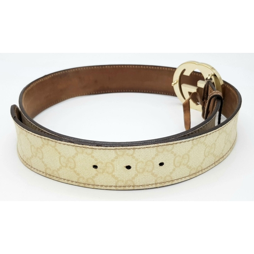 1377 - A Gucci Beige GG Canvas Belt with Gold-Toned GG Buckle. Light gold hardware, 102cm total length. Som... 