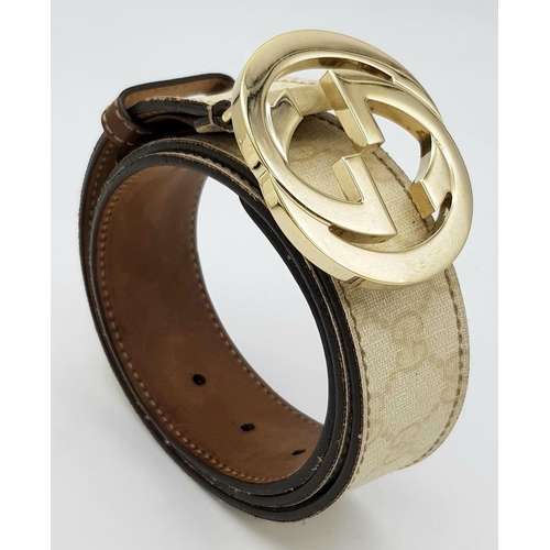 1377 - A Gucci Beige GG Canvas Belt with Gold-Toned GG Buckle. Light gold hardware, 102cm total length. Som... 