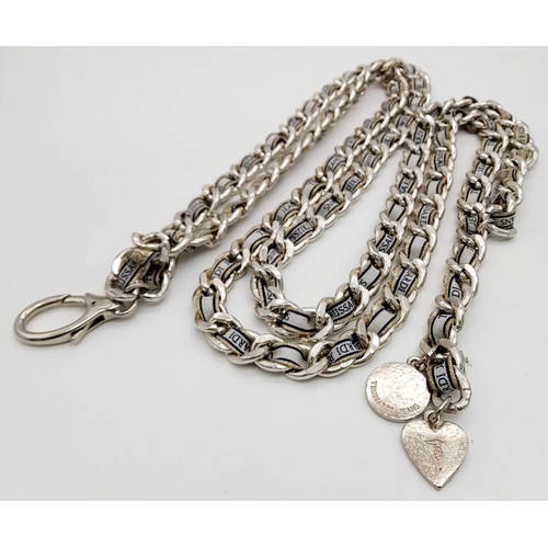 1384 - A Trussardi Silver-Toned Double Chain Belt. Silver-toned metal interwoven with fabric embroidered wi... 