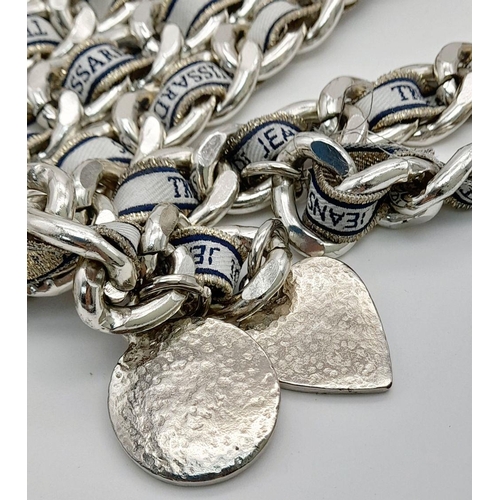 1384 - A Trussardi Silver-Toned Double Chain Belt. Silver-toned metal interwoven with fabric embroidered wi... 