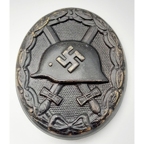 290 - A WW2 German 3rd Class Wound Badge in Black Representing Iron & Award Certificate to a soldier in th... 