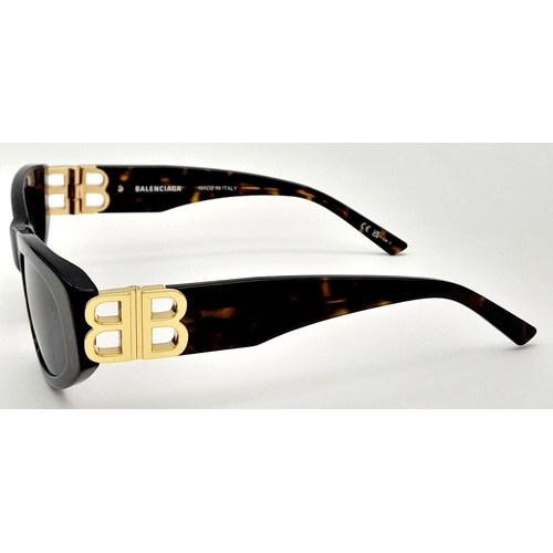 1325 - A Pair of Balenciaga Sunglasses, frames with gold-toned 