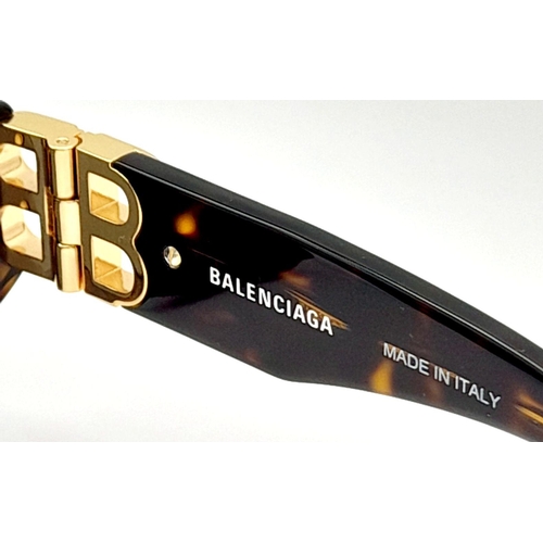 1325 - A Pair of Balenciaga Sunglasses, frames with gold-toned 