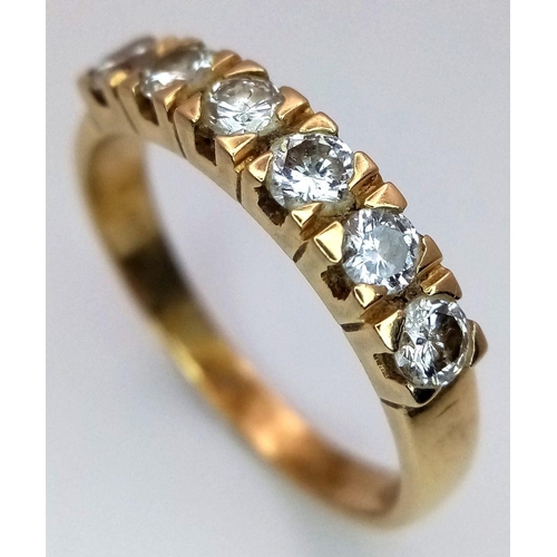 1074 - An 18K Yellow Gold (tested) Six Diamond Ring. 0.6ctw. Size U. 4.6g total weight. Ref: STK019786