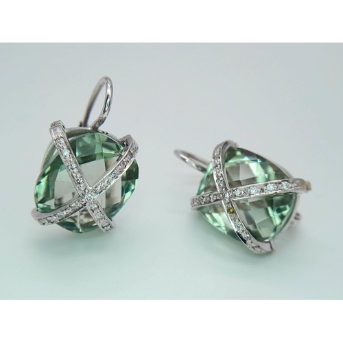 1342 - A Pair of 18K Gold and Diamond Crossover Green Prasiolite Earrings. 8.4g total weight.