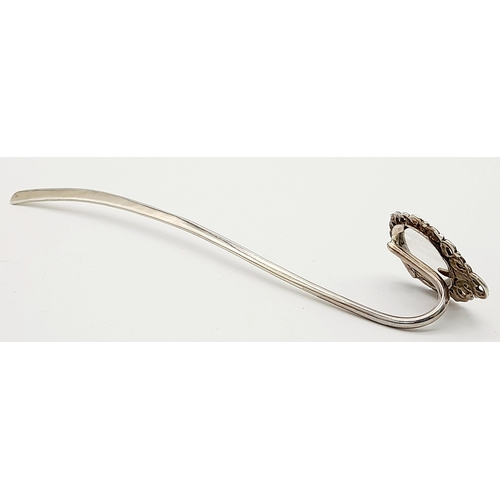 1087 - An Antique Sterling Silver Decorative Hair Pin. Shoe horn form with ornate decoration. 15cm. 13g