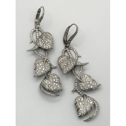 750 - A Beautiful Pair of Art Deco Style 14K White Gold and Diamond Drop Earrings. Floral form. One stone ... 