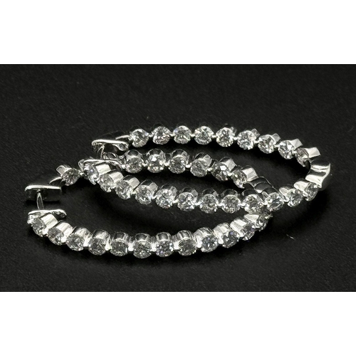 680 - A Pair of 18K White Gold and Diamond Oval Hoop Earrings. 48 diamonds in total - 2ctw approx. 6.3g to... 