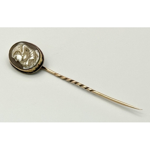 1310 - An Antique 9K Yellow Gold Cameo Stick Pin. 8cm. 4g total weight.