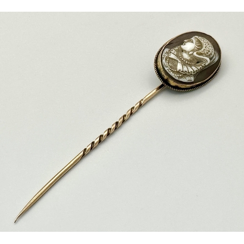 1310 - An Antique 9K Yellow Gold Cameo Stick Pin. 8cm. 4g total weight.