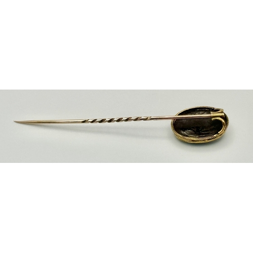 1310 - An Antique 9K Yellow Gold Cameo Stick Pin. 8cm. 4g total weight.