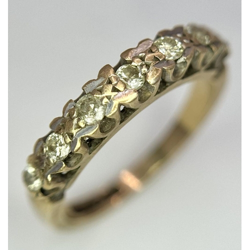 1374 - A 9K Yellow Gold Seven Stone Diamond Ring. Size K. 2.5g total weight.