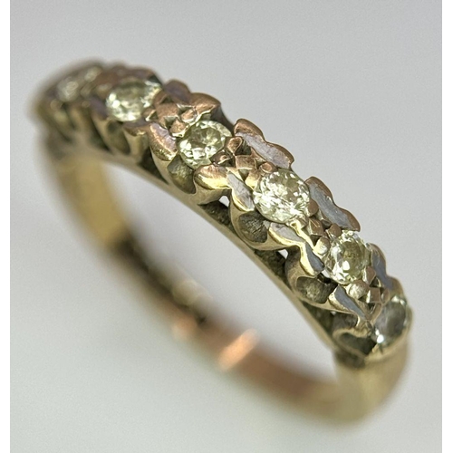 1374 - A 9K Yellow Gold Seven Stone Diamond Ring. Size K. 2.5g total weight.