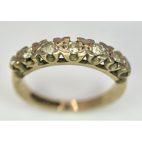 1374 - A 9K Yellow Gold Seven Stone Diamond Ring. Size K. 2.5g total weight.