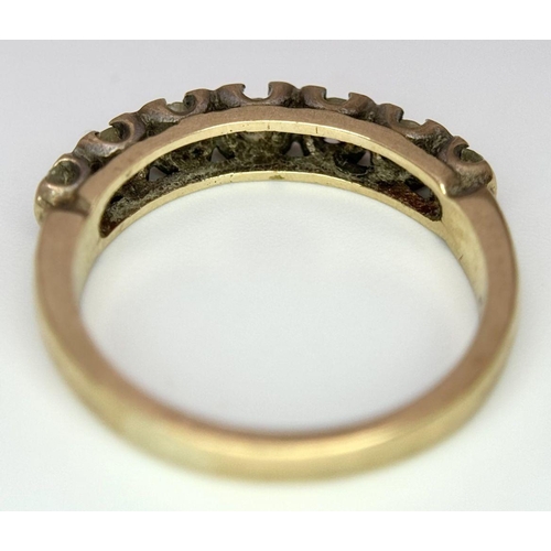 1374 - A 9K Yellow Gold Seven Stone Diamond Ring. Size K. 2.5g total weight.