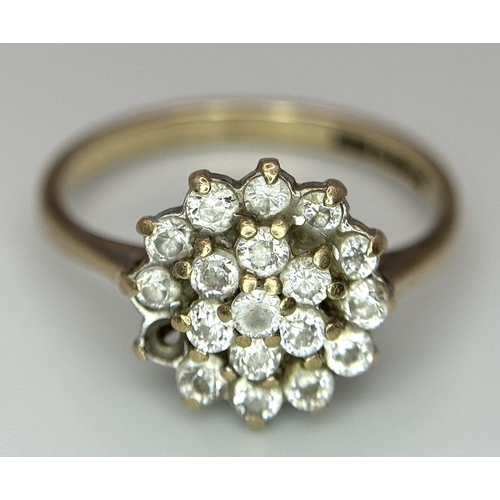 1395 - A 9K Yellow Gold White Stone Cluster Ring. One stone missing. Size K. 2.2g