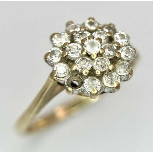 1395 - A 9K Yellow Gold White Stone Cluster Ring. One stone missing. Size K. 2.2g