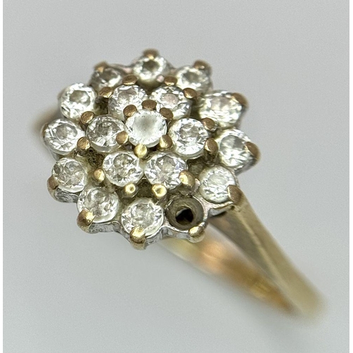 1395 - A 9K Yellow Gold White Stone Cluster Ring. One stone missing. Size K. 2.2g