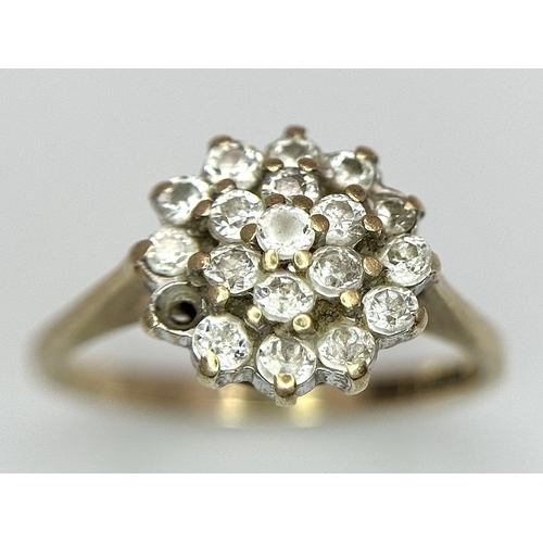 1395 - A 9K Yellow Gold White Stone Cluster Ring. One stone missing. Size K. 2.2g