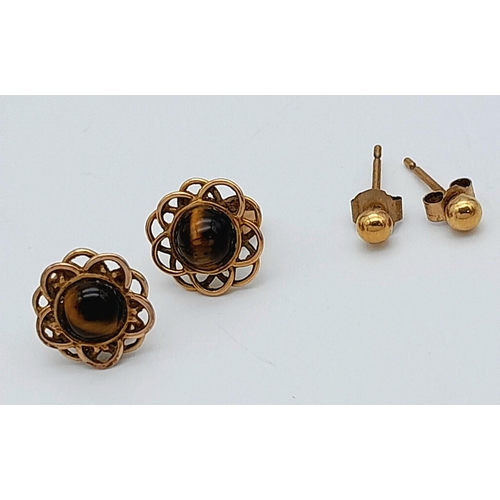 1388 - Two Pairs of 9K Yellow Gold Stud Earrings. Ball and Tigers Eye. 1.4g total weight.