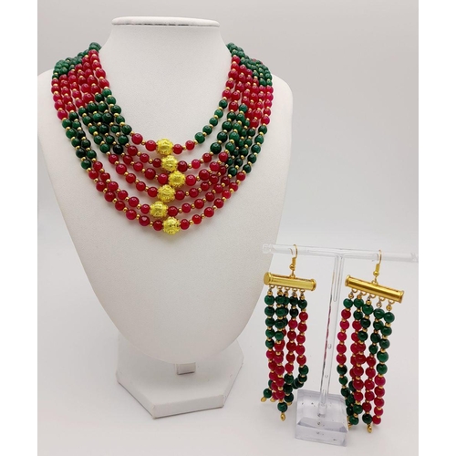 1283 - A substantial six row necklace with green and red jade highly polished beads in a geometric design, ... 